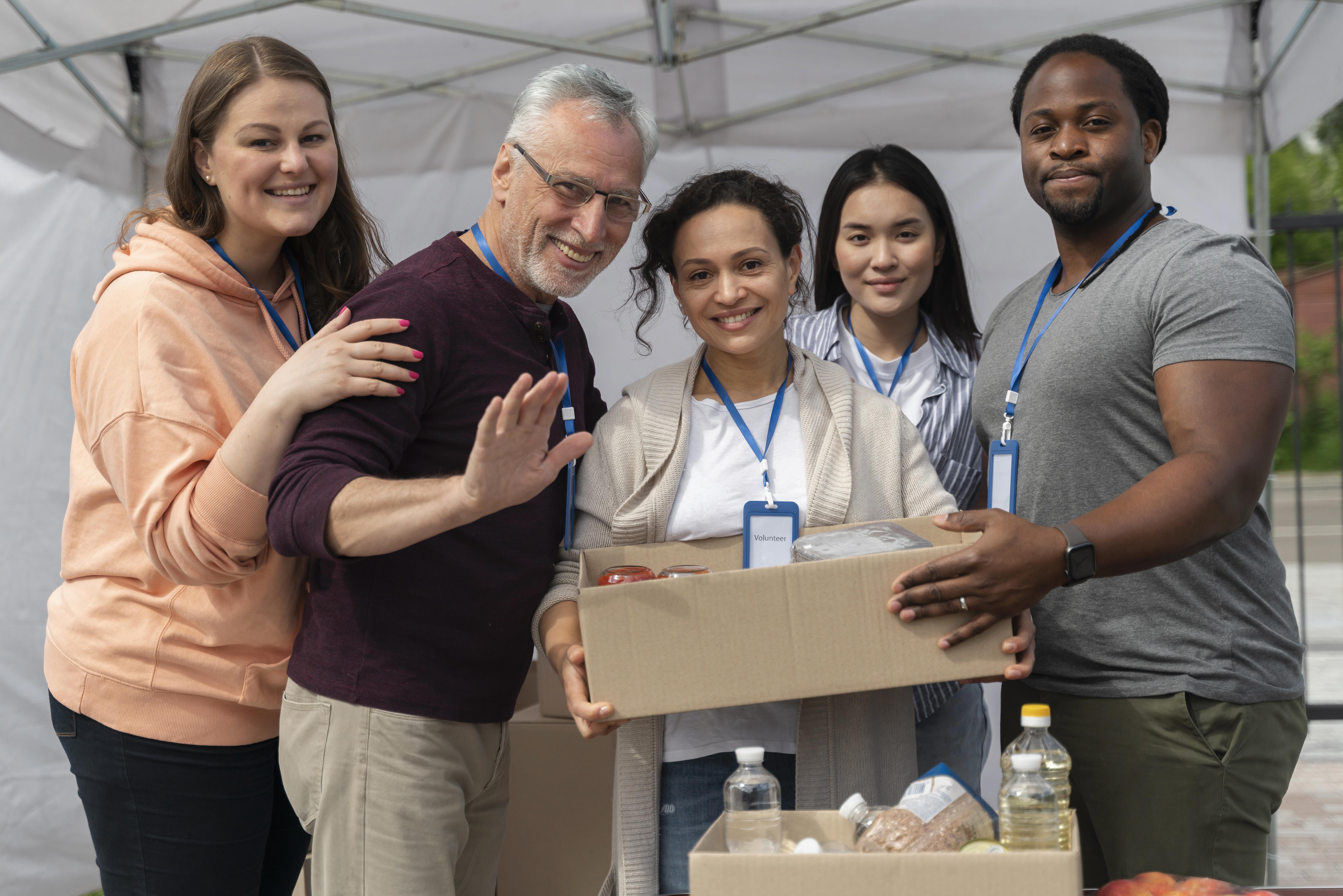 Group of people volunteering at a food bank, representing the foundation's humanitarian efforts